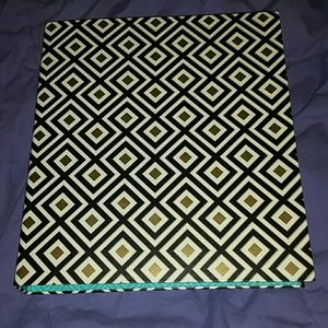Black, white, and gold binder